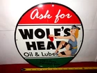 VINTAGE 11 3/4 in WOLF`S HEAD OIL & LUBE ADV SIGN HEAVY METAL PORCELAIN - S 75 B