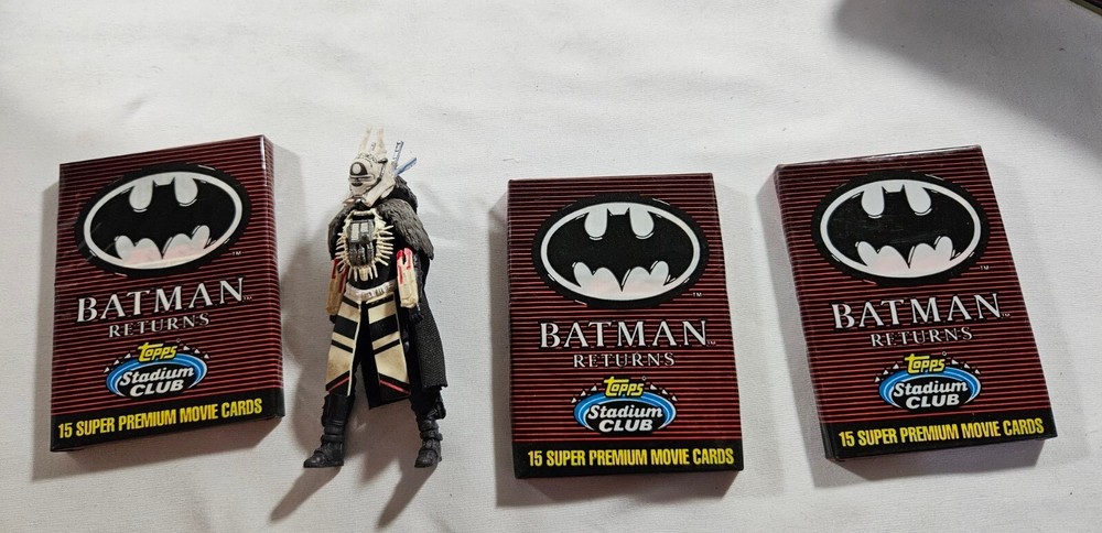 3 Packs of Batman Returns Cards, A 4-inch Figure, and a Car Racing-Themed Tin Bo