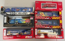 VTG RACING CHAMPIONS/hotwheels LOT OF 7 1/64 RACING TEAM TRANSPORTERS With Boxes
