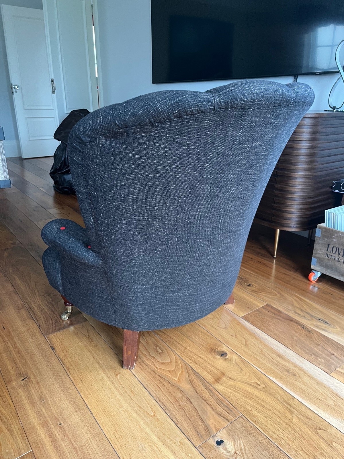 Charcoal low armchair with red buttons eBay