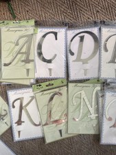 Lote de adornos iniciales para pasteles. Nuevo en paquetes