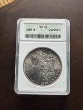 1889 Morgan Silver Dollar ANACS MS63 Old Soapbox Holder RIM TONER