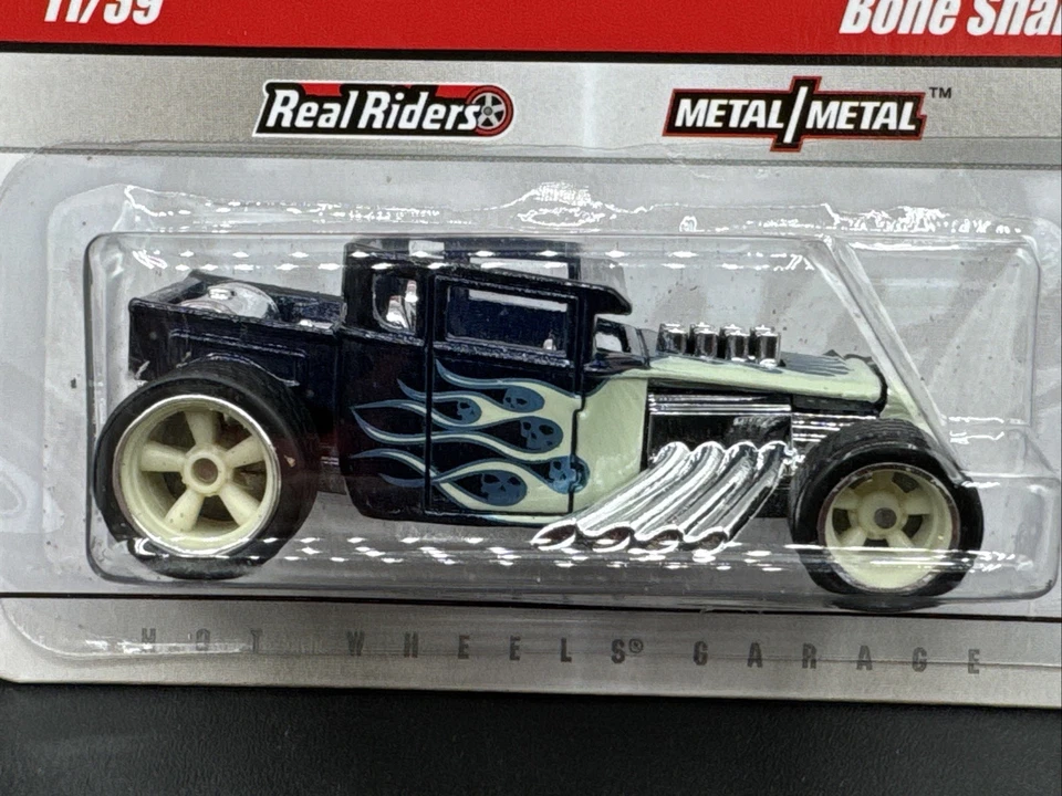 Hot Wheels Larry's Garage Chase 2009 agitador de huesos azul 11/39 bujes blancos envío gratuito Foto 2 de 4