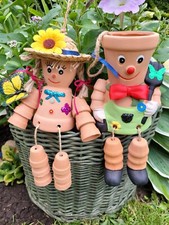 PAIR BILL & BEN TERRACOTTA FLOWER POT MAN AND LADY SITTING OR HANGING XMAS GIFT.