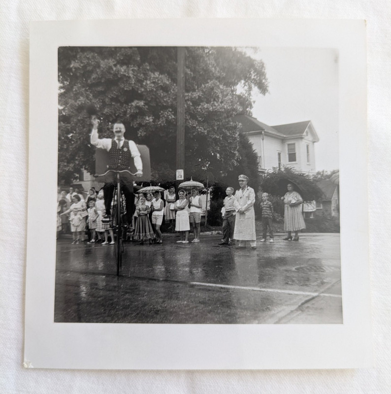 Man Riding a Penny Farthing High Wheel Bicycle Snapshot Photo