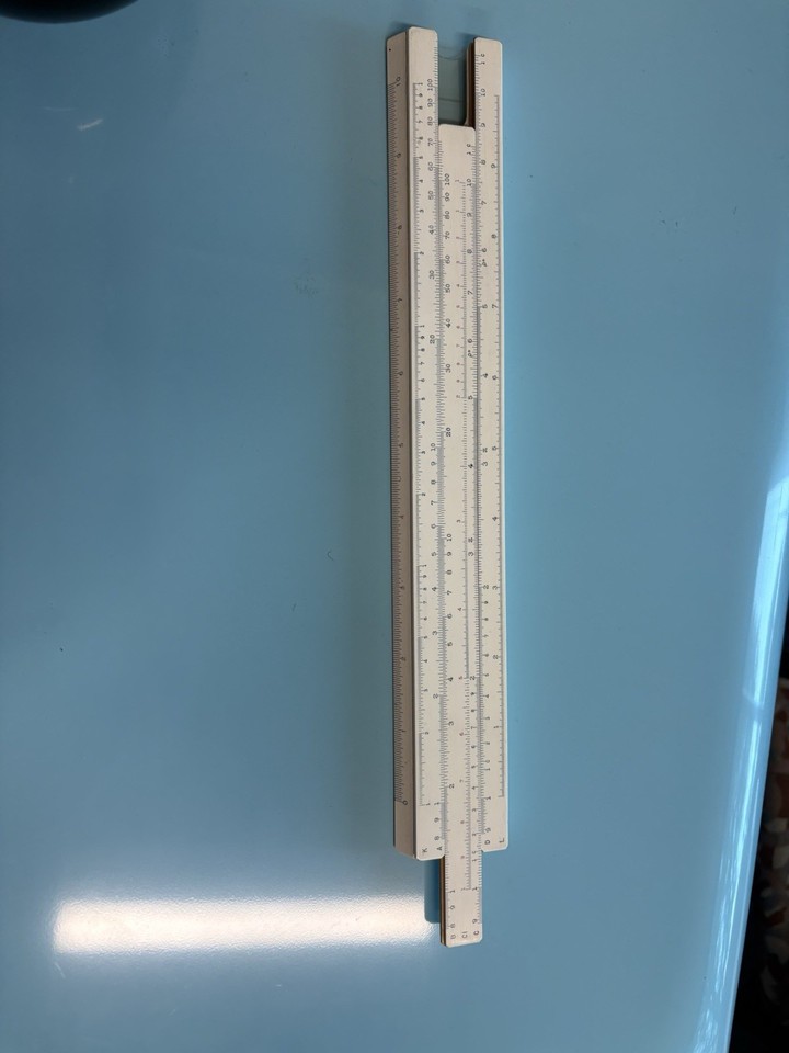 A 1964 Edmund Scientific bamboo slide rule made in Japan — bamboo construction makes this genuinely rare and visually striking among slide rule collectors.