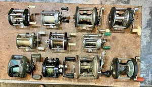 Lot of 11 Miscellaneous Conventional / Baitcast fishing reels • parts or repair