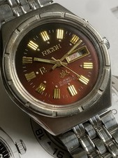 Orologio Ricoh Uomo Automatico AA Quadrante Rosso. Giorno/Data 21 Gioielli. Funzionante molto bene