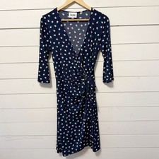 Leota | jersey wrap dress in a navy blue and multi-colored polka dot pattern M