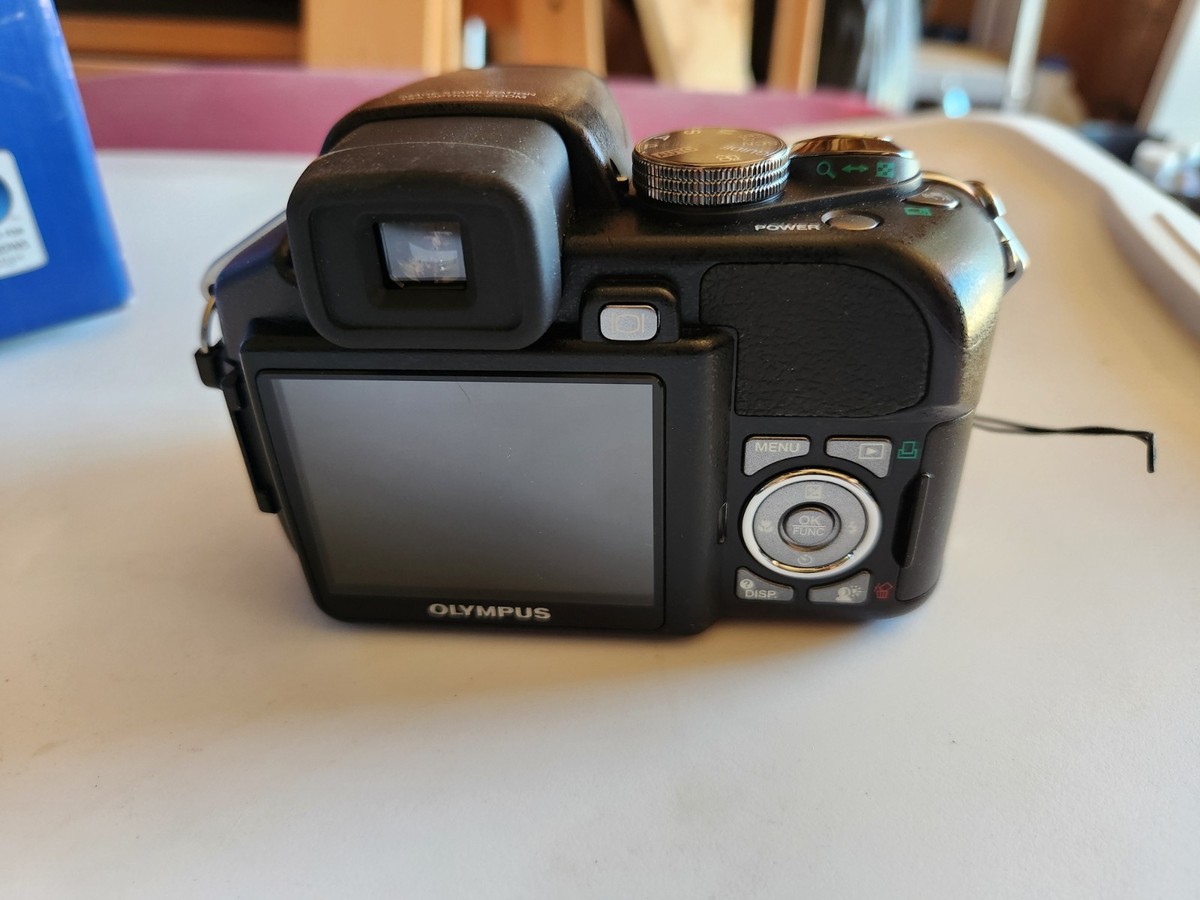 Olympus SP Series SP-560 UZ 8.0MP Digital Camera - Black for