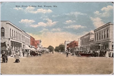 Waupun Wisconsin postcard Main Street Scene looking East Model T s Unposted