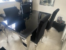 Abdon Black Glass Dining Table With Silver Legs And 4 Chairs