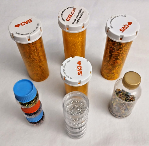 7 tubes of beads for making jewelry making 4 tall and 4 short tubes