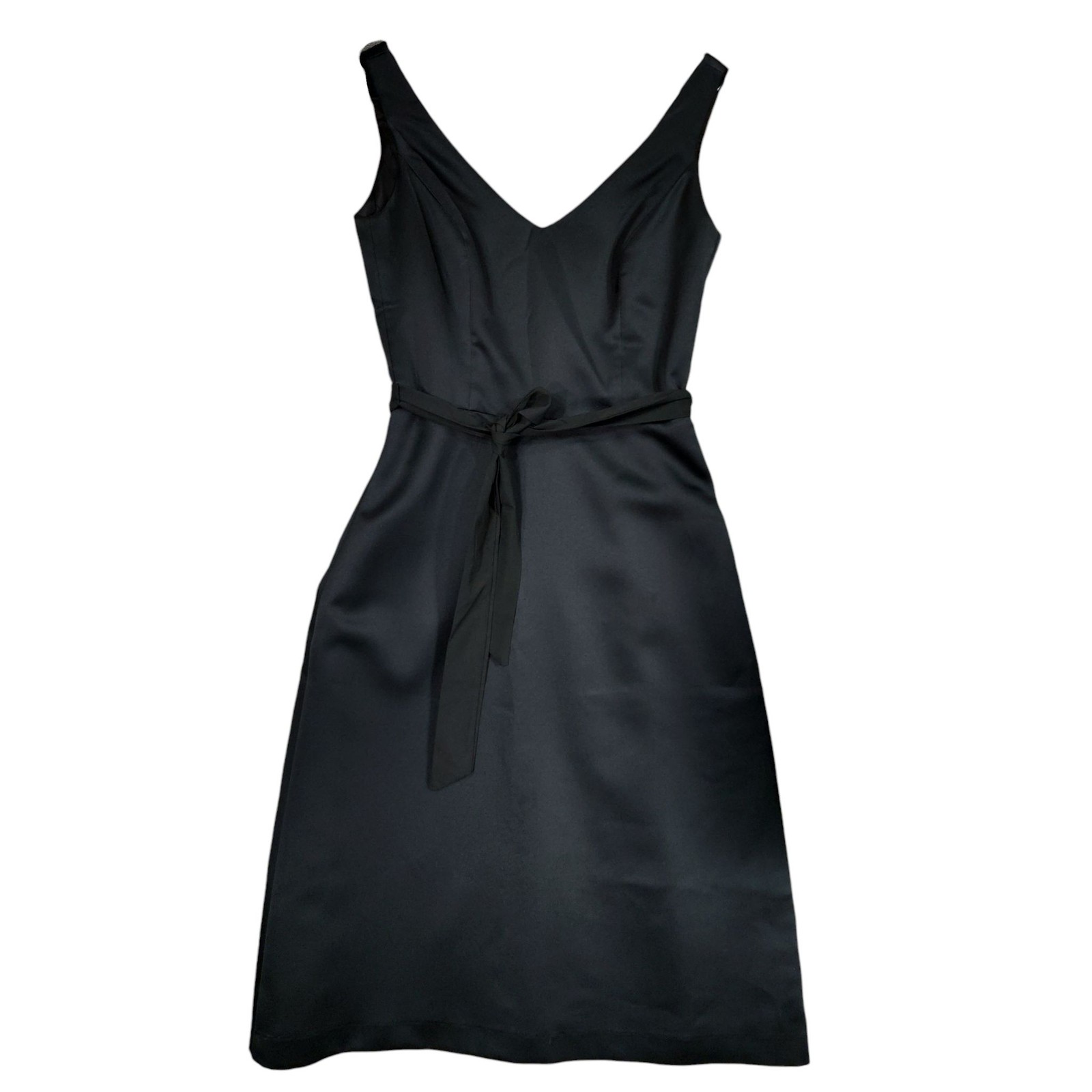 Black satin cocktail dress with a V-neck and tie-waist sash.