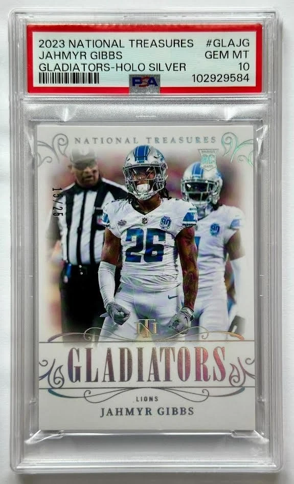 Jahmyr Gibbs Panini National Treasures Gladiators #GLAJG Holo Silver