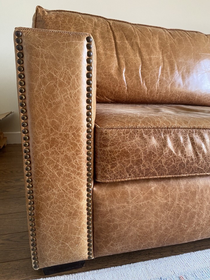 RARE TAN STUDDED ARM SOFA LEATHER STATEMENT SOFA SIMILAR TO TIMOTHY