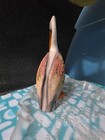 A rustic, stylized pelican figurine — photo 4