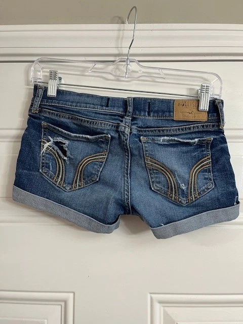 Mini micro pantalones cortos de mezclilla Hollister lavado medio Y2k tiro bajo dobladillo con puños talla 00/23 Foto 2 de 4