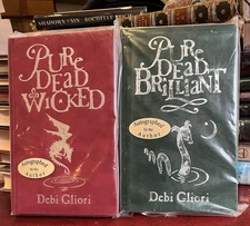 2 SIGNED CHILDREN’S/FANTASY-DEBI GLIORI “PURE DEAD WICKED”&”PURE DEAD BRILLIANT”
