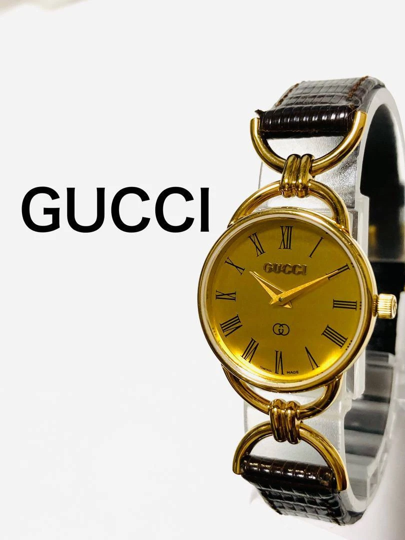 Montre femme Gucci ceinture pile dorée