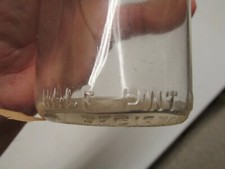 ONE HALF PINT MILK BOTTLE WITH LID
