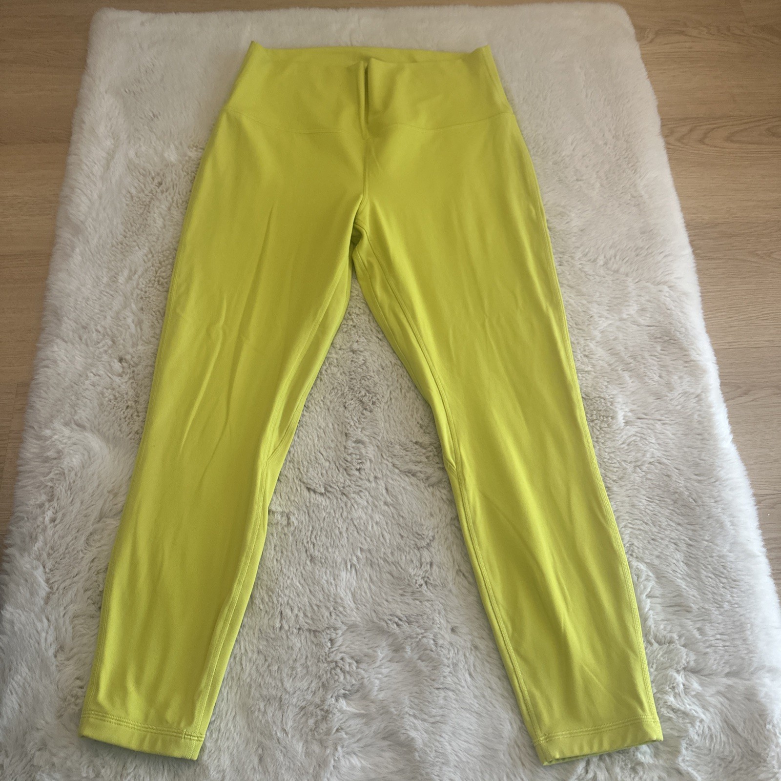 Lululemon women’s high-rise leggings in neon yellow. Stretchy, Size 12