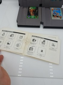 NES Games Bundle Of 4 Ikari Warriors 2 Tecmo Bowl Bionic Commando Winter Games