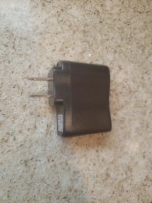 Ac/Dc Adapter Model: SK05G-0500100U Input: 100-240v 50/60Hz 0.2A Output: .5V 1A