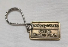 VINTAGE MCQUAY-NORRIS  FIRST IN ENGINE PARTS  BRASS KEY FOB