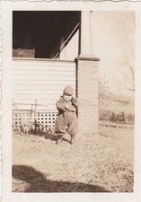 1920s Vintage photo of a kid bundled up for colder weather, found photos