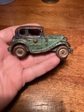 AC Williams Early 1920s Cast Iron red A.C Williams Austin Sedan Toy Motor Car