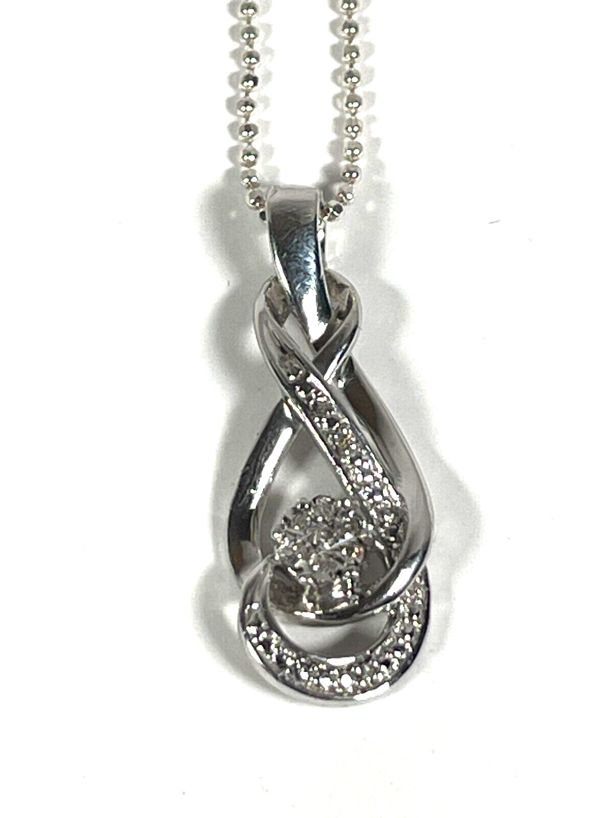 Interlocking Infinity Symbol with Diamond Chips S… - image 1