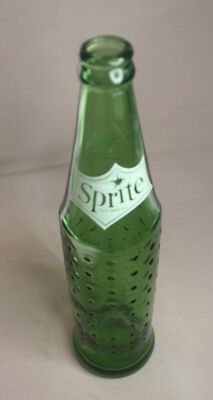ADVERTISING SPRITE SODA GREEN GLASS BOTTLE WITH DIMPLES 10 OZ. WHITE AC LABEL