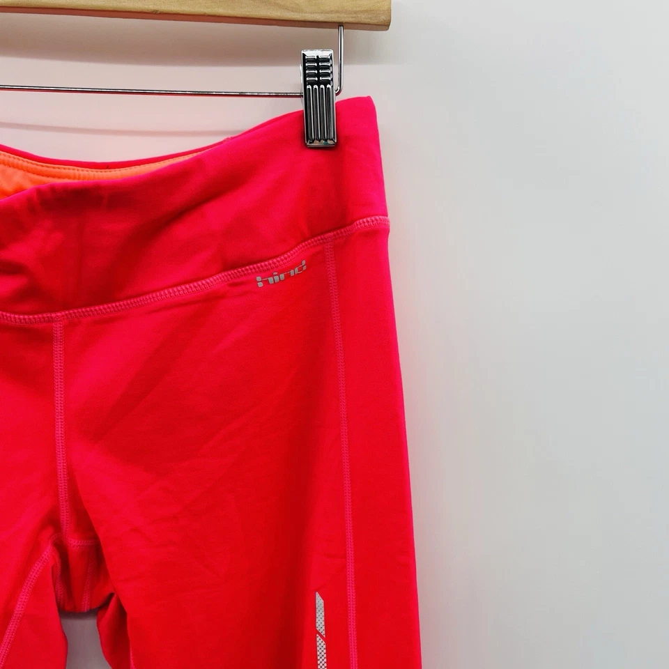 Pantalones al tobillo deportivos forrados de vellón reflectantes talla mediana Hind para mujer en rosa Foto 2 de 4