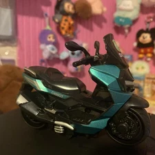 Mini Swat Motorcycle Model Toy Pictured with Labubu Doll