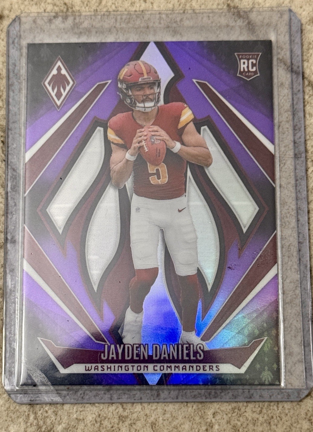 2024 Panini Phoenix - Rookies Jayden Daniels #198 Purple Fade (RC)