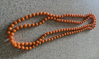VINTAGE 24" 1950'S PLASTIC ORANGE BEADED NECKLACE — photo 2