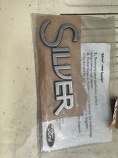 KIT BADGE ARRIÈRE ARGENT FORD FOCUS MK1 PIÈCE DÉTACHÉE N° SP9125 ORIGINE FORD nos
