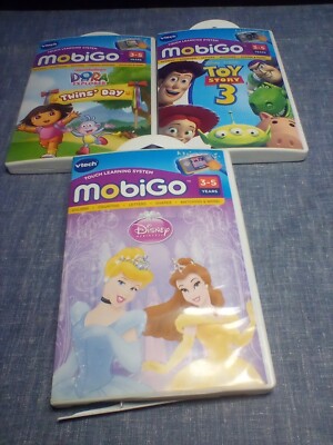 Three V-Tech Mobigo Disney Princess, Toy Story 3, & Dora Games Ages 3-5 Years.