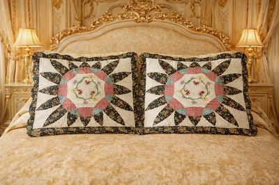 Two quilted patchwork pillow shams, 20'' × 26''