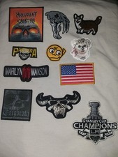 miscellaneous sew on patch lot. 11 patches. jacket patches. clothes patches.