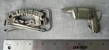 Vintage Drill 1980 Bergamot Brass Works and 1967 Plumber Pipe Wrench belt buckle