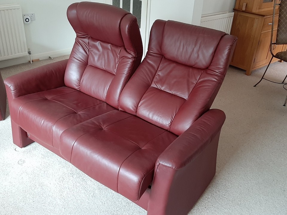 2 seater leather reclining sofa and armchair, with footstool. High