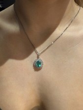 18ct White Gold 2.75ct Oval Emerald And Round Diamond 0.83ct Cluster Necklace