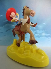 FIGURINE DISNEY PIXAR TOY STORY JESSIE SUR PIL POIL mesure +/- 10,5cm