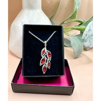 New in box Avon Vintage SAQ Silver Tone and Faux Ruby Rhinestone Leaf Necklace
