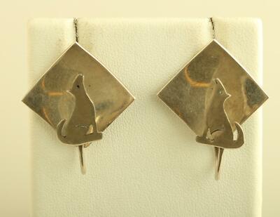 Vintage diamond shaped sterling silver with Howling Wolf stud