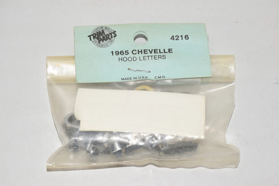 "Chevelle" 1965 nuevo capó emblema letras molduras piezas # 4216 - EE. UU. Foto 4 de 4