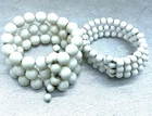 2 Vintage Spring Action Milk Glass Beaded Bracelets Costume Jewelry Nice Weight!