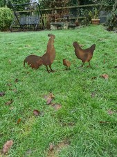 rusty metal garden ornaments, cock, hen and chick